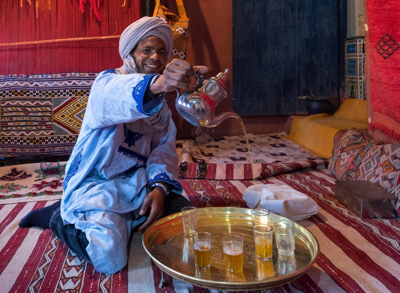Moroccan man pouring tea